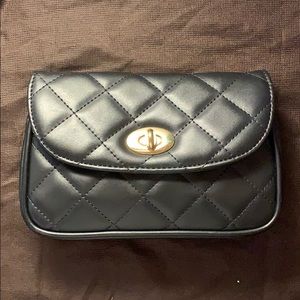 Soft black quilted purse with turn-key closure